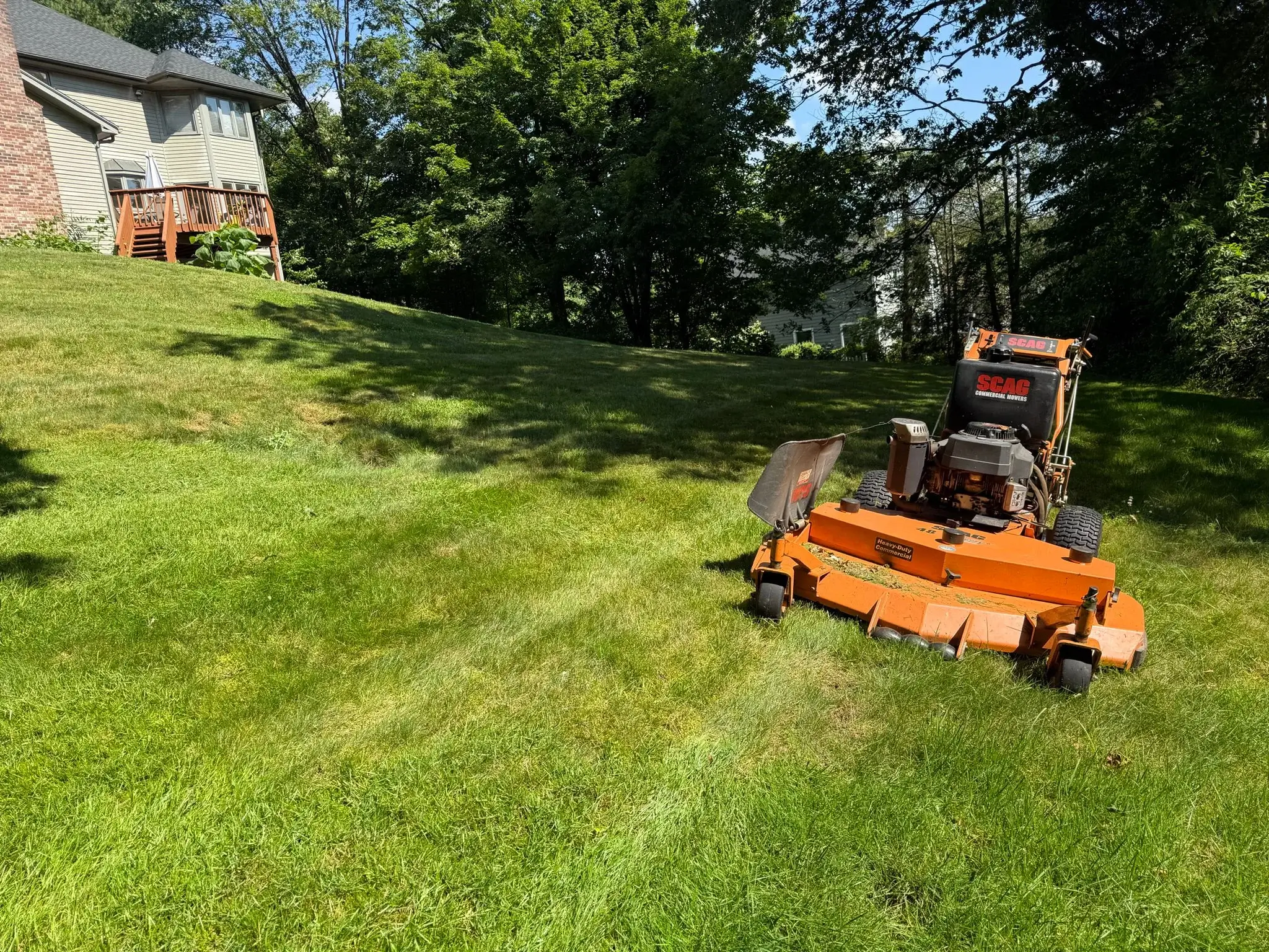 Commercial lawn care service with freshly mowed grass and professional striping in Connecticut.
