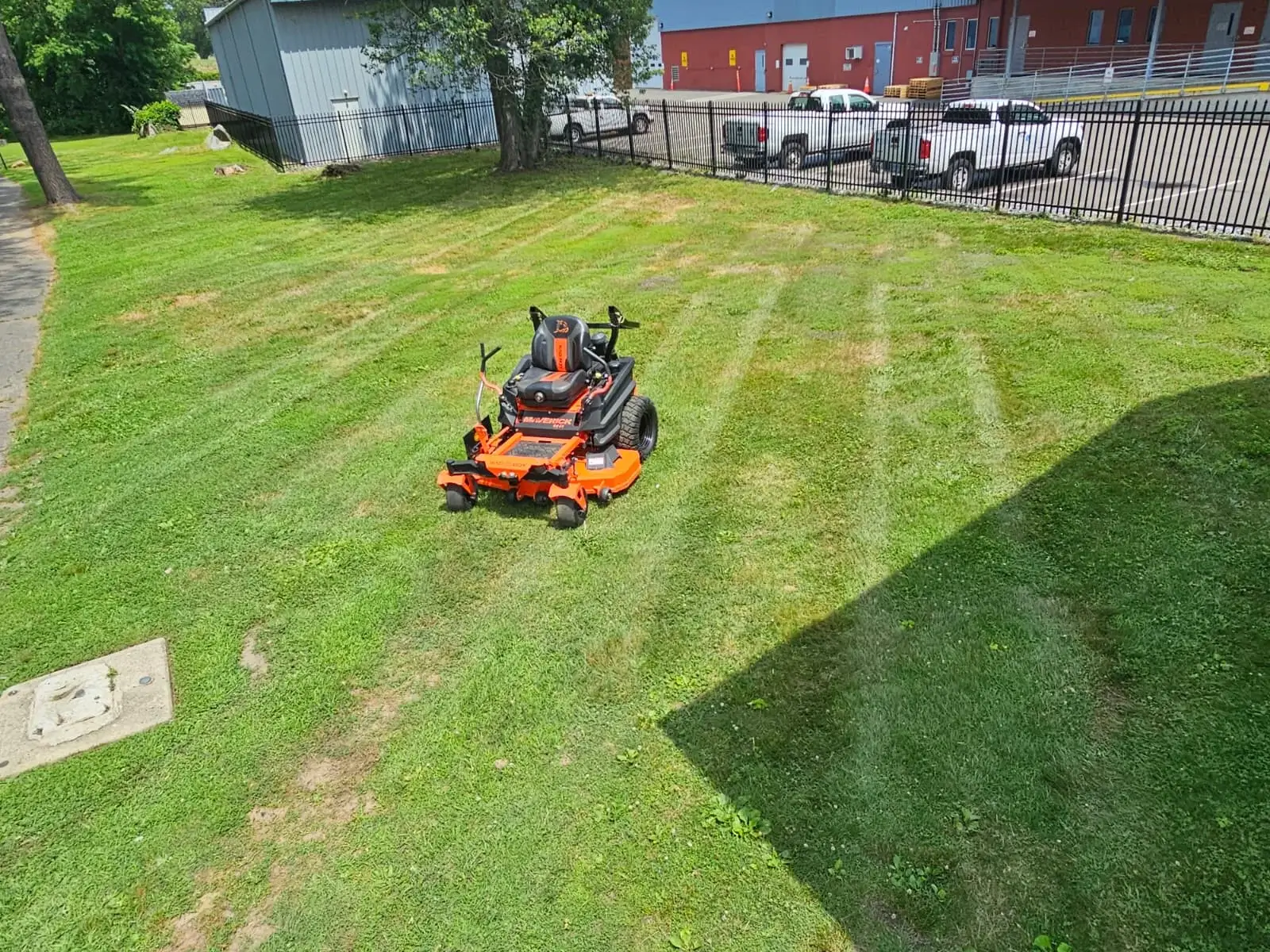 Commercial lawn care service with freshly mowed grass and professional striping in Connecticut.