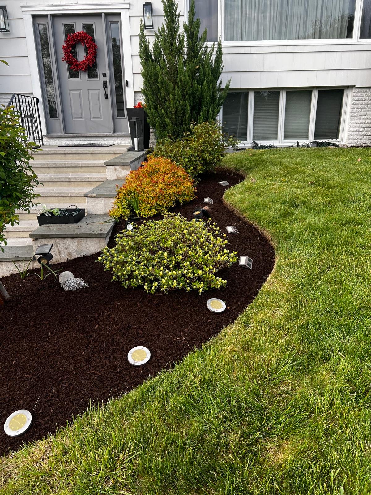 Mulching and planting installation service in Connecticut by M&G Landscaping & Lawn Care LLC, creating healthy and well-designed landscape beds.