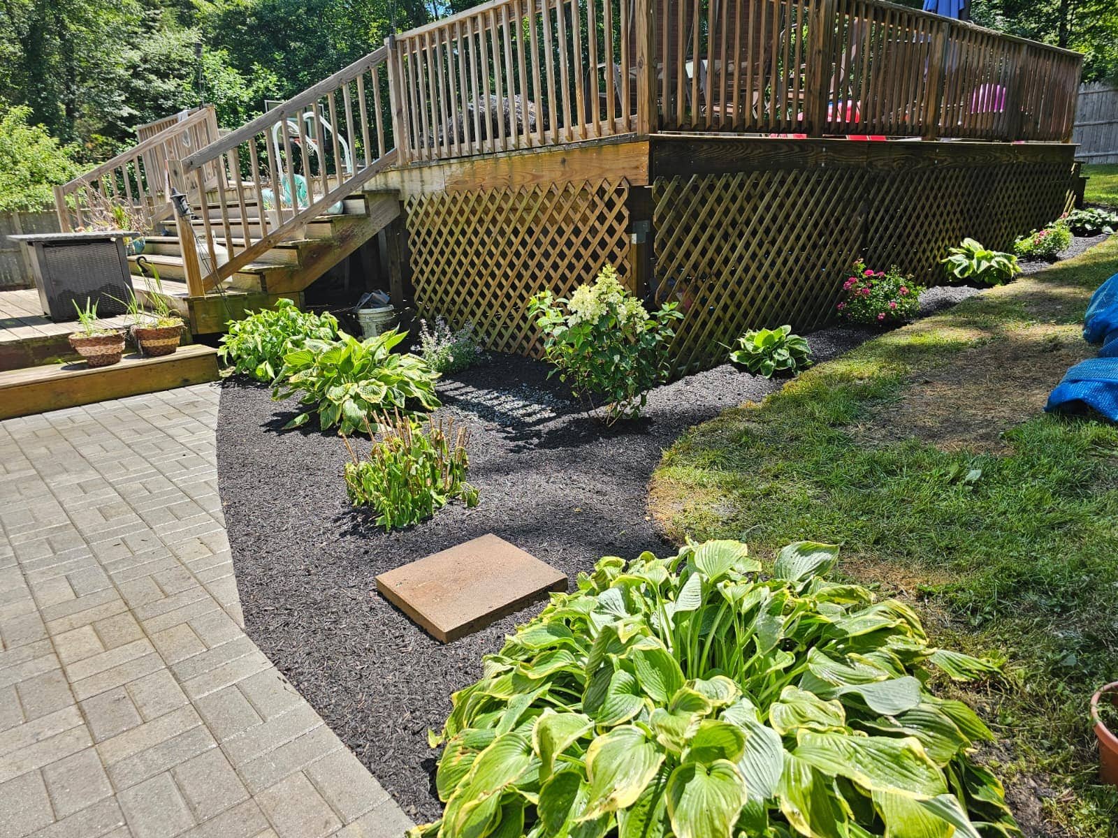 Planting and mulching around deck and patio by M&G Landscaping & Lawn Care LLC in Fairfield, CT